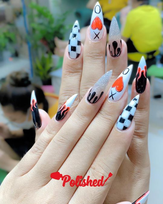 Stiletto nails with checkered patterns, Edgy Hearts and Flames for Valentine's Day Nail