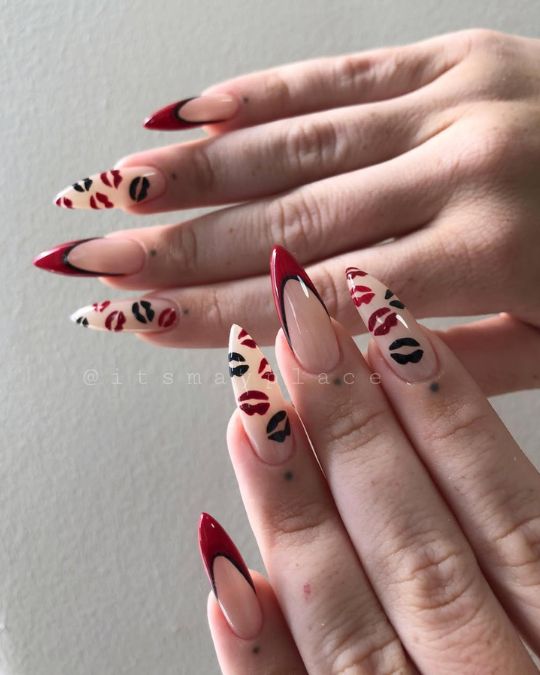 Stilettos nails Nude base, red tips, flirty lip prints.