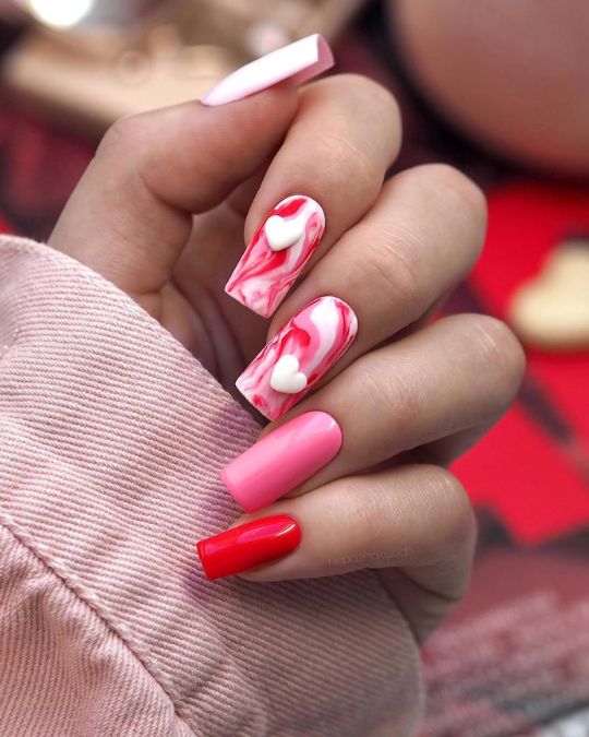 Square-tipped nails with red and pink marble effects