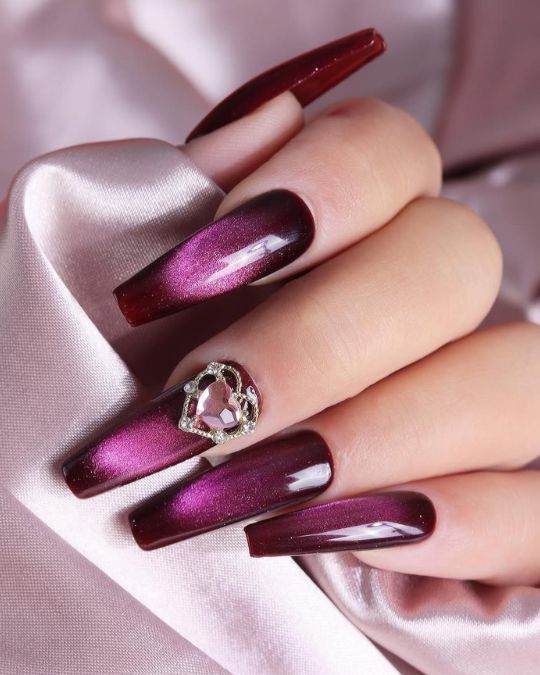 deep purple, shimmering nails with a jeweled heart