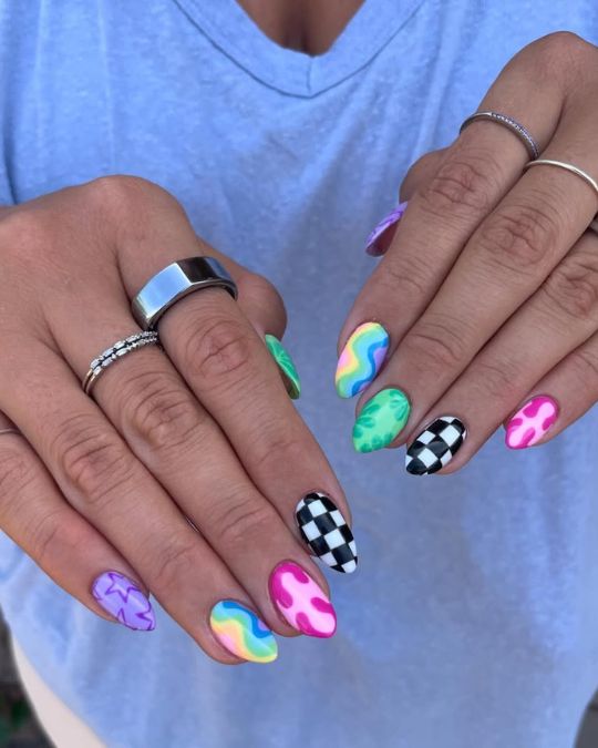 45 Best Summer Nail Ideas to Heat Up Your Style 43 short almond mismatched nails of rainbow swirls, checkerboard patterns, and funky designs