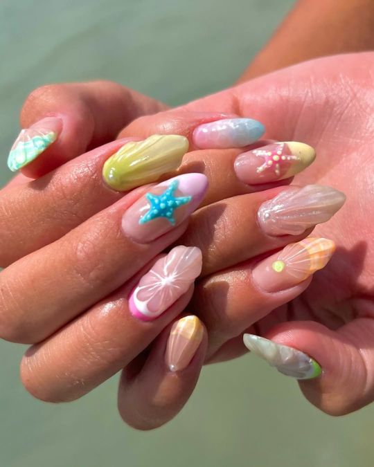 45 Best Summer Nail Ideas to Heat Up Your Style 40 beach inspired almond nails with pastel hues, starfish designs, and pearlescent finishes