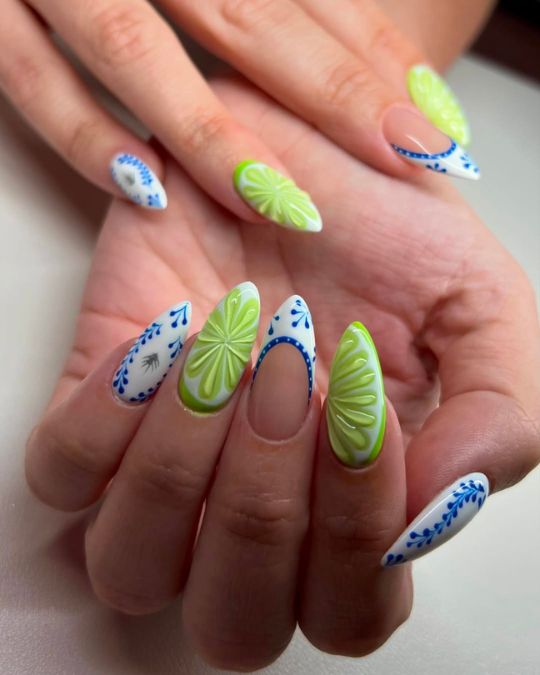 45 Best Summer Nail Ideas to Heat Up Your Style 19 Bright green lemon designs stand out against light blue porcelain-inspired french tip