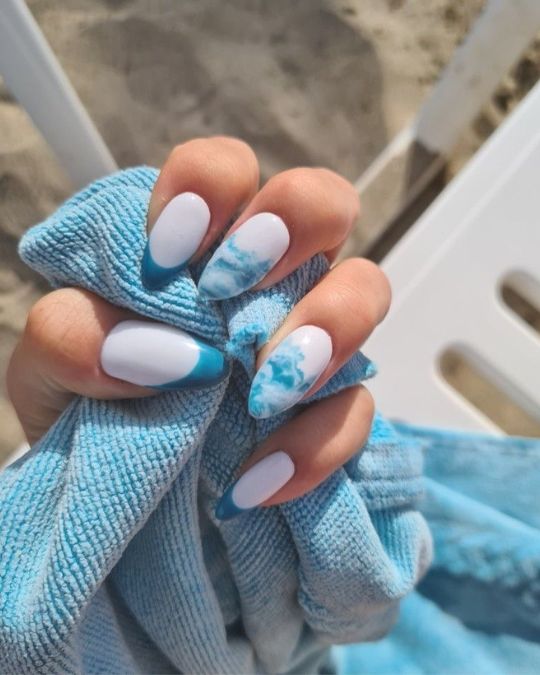 45 Best Summer Nail Ideas to Heat Up Your Style 15 Crisp white base with swirling blue marble and French tips almond nails