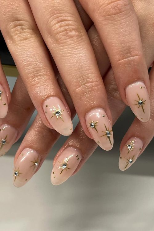 30 Stunning Graduation Nail Designs to Celebrate Your Big Day in 2025 3 Celestial Nude Elegance