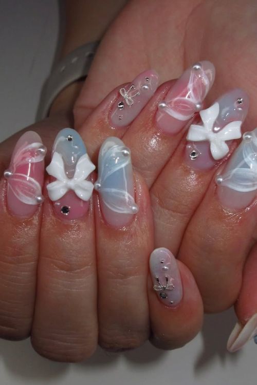 30 Stunning Graduation Nail Designs to Celebrate Your Big Day in 2025 19 Ethereal Bow & Butterfly